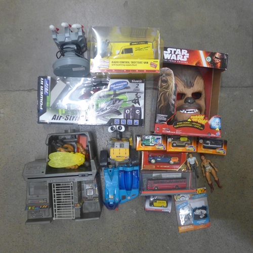 1161 - A box of assorted toys, including a Radio Control Trotter's Van, RC Air Striker Helicopter, Action F... 