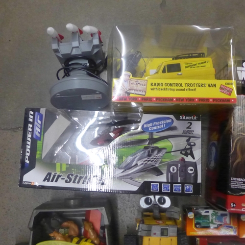 1161 - A box of assorted toys, including a Radio Control Trotter's Van, RC Air Striker Helicopter, Action F... 