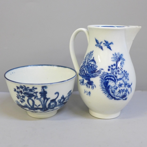 624 - An 18th Century Worcester blue and white tea bowl and sparrow beak jug, both with crescent mark, bot... 