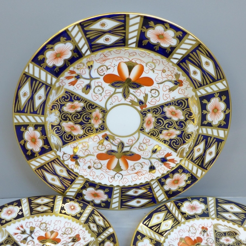 642 - Three Royal Crown Derby 2451 pattern items, a plate, side plate and saucer