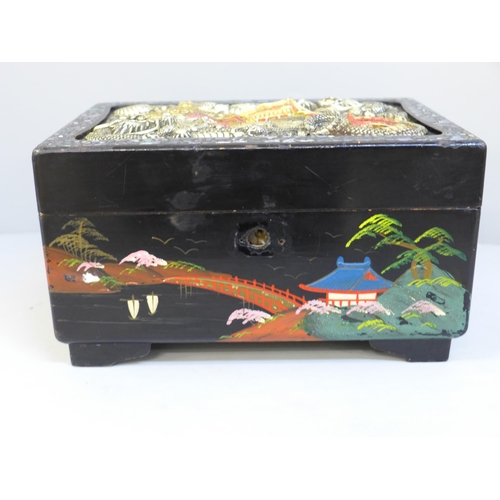 646 - A Japanese lacquered musical jewellery box