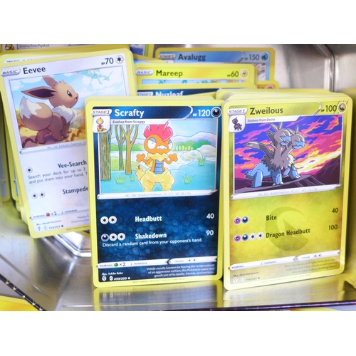 651 - A tin of approximately 300 Pokemon cards