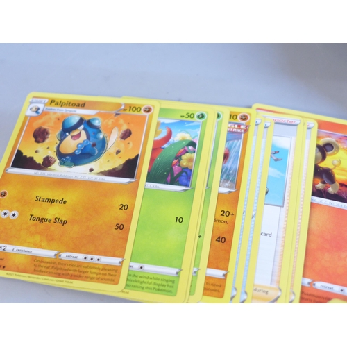 651 - A tin of approximately 300 Pokemon cards