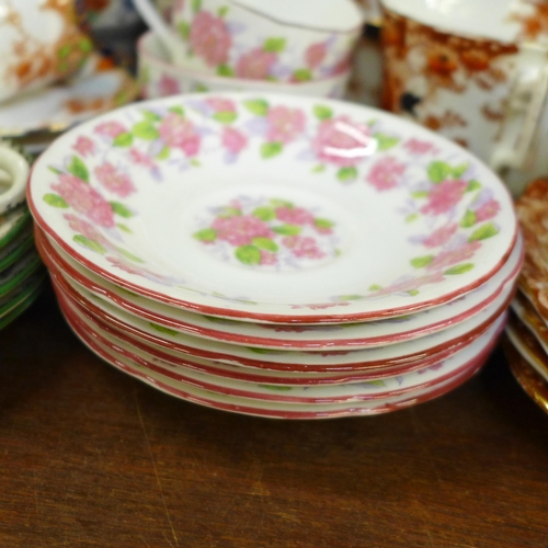 670 - A Grafton tea set decorated with pink flowers, a Spode tea set and a Wellington china part tea set *... 