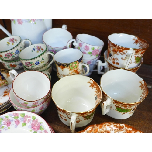 670 - A Grafton tea set decorated with pink flowers, a Spode tea set and a Wellington china part tea set *... 