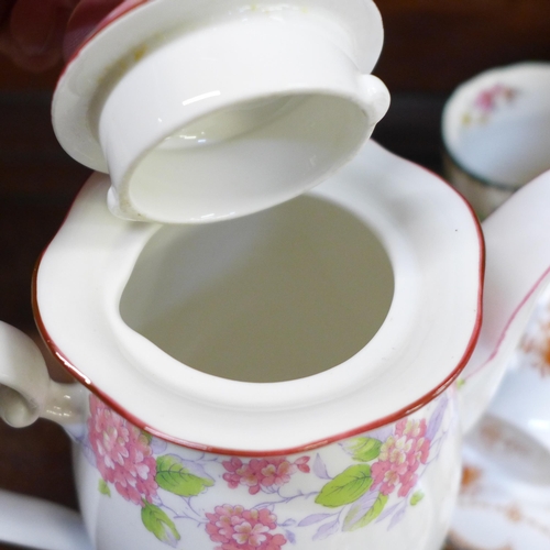 670 - A Grafton tea set decorated with pink flowers, a Spode tea set and a Wellington china part tea set *... 