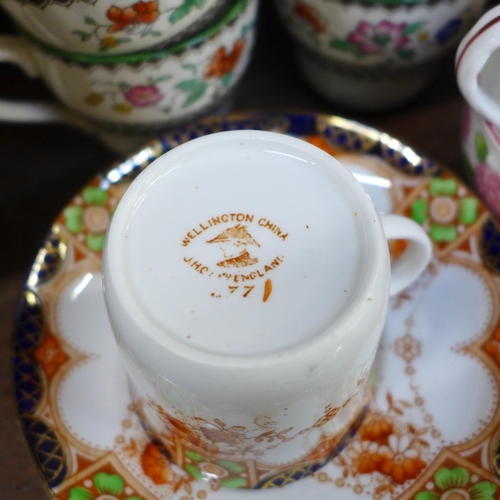 670 - A Grafton tea set decorated with pink flowers, a Spode tea set and a Wellington china part tea set *... 