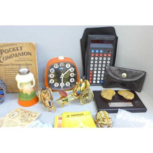 672 - A collection of assorted items including stamps, Pokemon cards, a clock, etc.