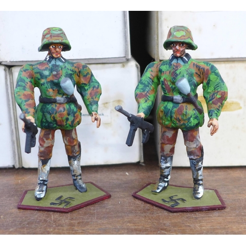 685 - A collection of metal German military figures, Waffen SS in camo smock, boxed (37)