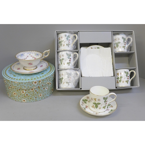 689 - A Wedgwood Wild Strawberry six setting coffee set, boxed, and a Wedgwood Harlequin Collection cup an... 