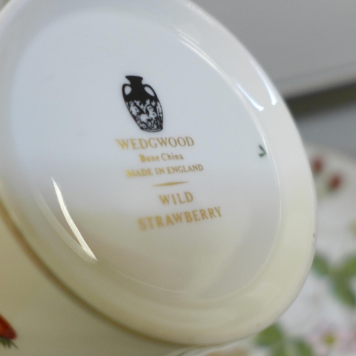 689 - A Wedgwood Wild Strawberry six setting coffee set, boxed, and a Wedgwood Harlequin Collection cup an... 