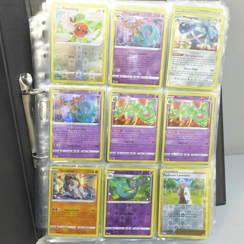 690 - A folder of approximately 300+ holographic Pokemon cards