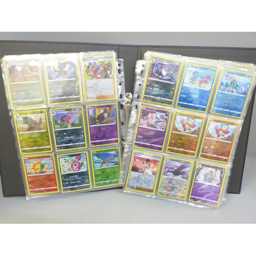 690 - A folder of approximately 300+ holographic Pokemon cards