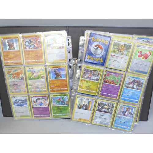 690 - A folder of approximately 300+ holographic Pokemon cards