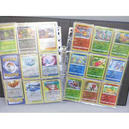 690 - A folder of approximately 300+ holographic Pokemon cards