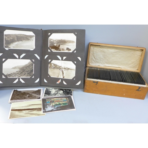 694 - An album of Edwardian and later postcards and a box of Edwardian glass negatives, mainly family grou... 