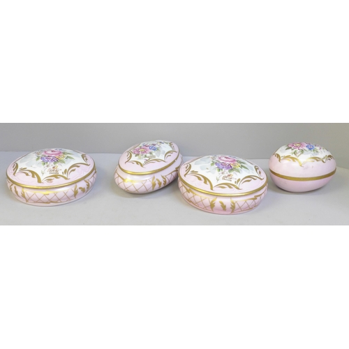 706 - A Limoges four piece dressing table set decorated with flowers against a pink ground **PLEASE NOTE T... 