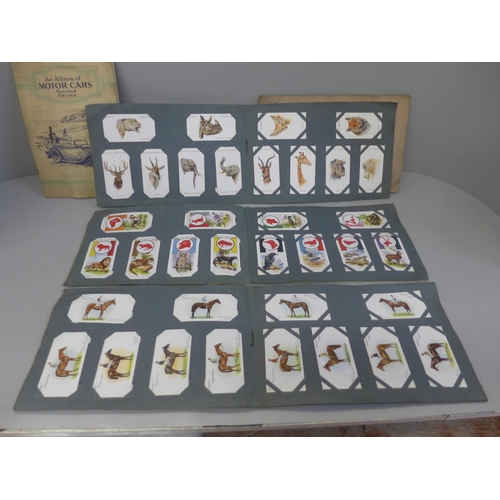 721 - A box of cigarette cards and albums