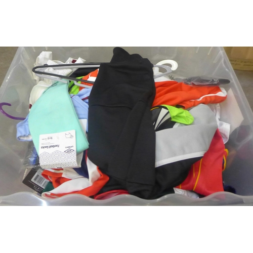 743 - A large box of football kit, jerseys including Manchester United Ronaldo, shorts and socks, male, fe... 