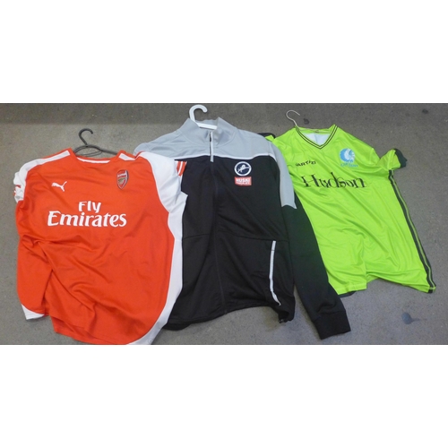 743 - A large box of football kit, jerseys including Manchester United Ronaldo, shorts and socks, male, fe... 