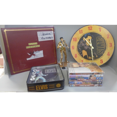 749 - Elvis Presley memorabilia, two scarves, a scrap album, DVDs, a figure, a clock, a belt buckle, etc.