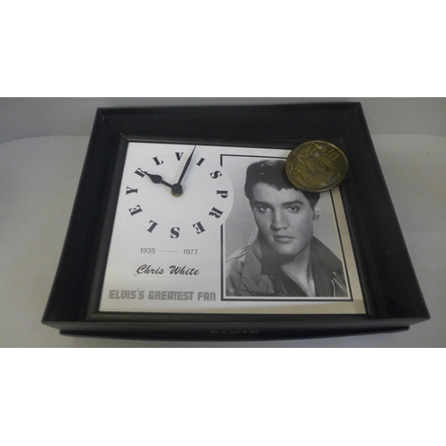 749 - Elvis Presley memorabilia, two scarves, a scrap album, DVDs, a figure, a clock, a belt buckle, etc.