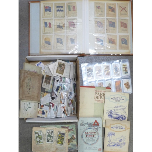 774 - Cigarette cards; a box of cigarette and trade cards, loose and in albums