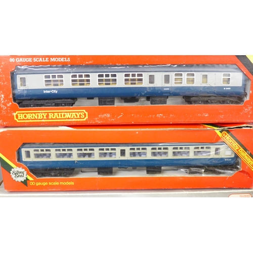 780 - A collection of model rail including eight blue/grey coaches, and a blue diesel Intercity locomotive