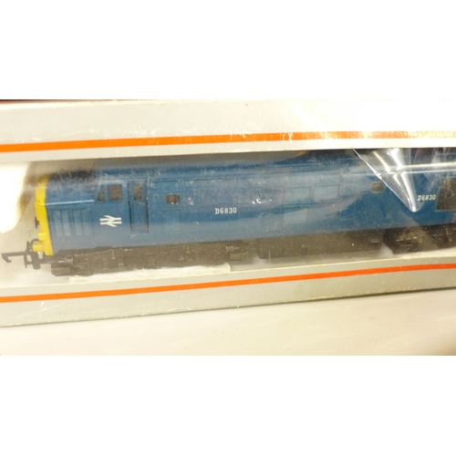 780 - A collection of model rail including eight blue/grey coaches, and a blue diesel Intercity locomotive