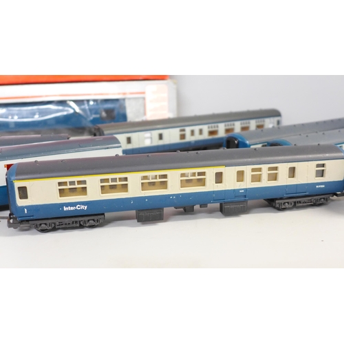 780 - A collection of model rail including eight blue/grey coaches, and a blue diesel Intercity locomotive