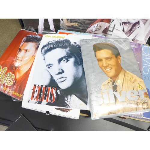 781 - Two artist's portfolios with Elvis Presley calendars and scraps