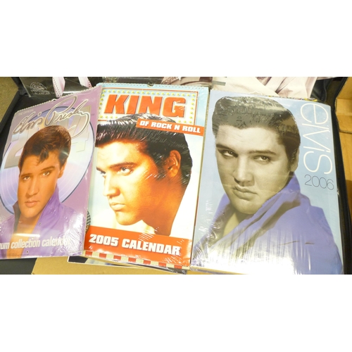 781 - Two artist's portfolios with Elvis Presley calendars and scraps