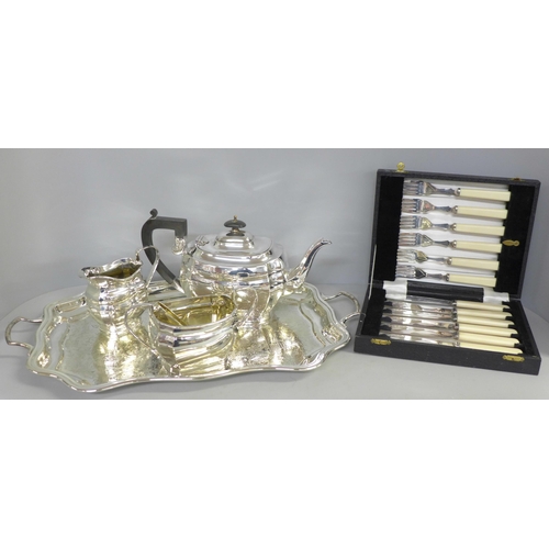 799 - A silver plated tea set on a gallery tray and a boxed set of EPNS fish knives and forks