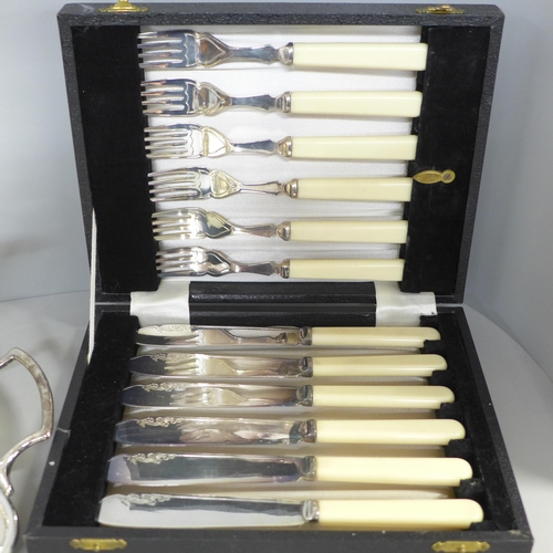 799 - A silver plated tea set on a gallery tray and a boxed set of EPNS fish knives and forks