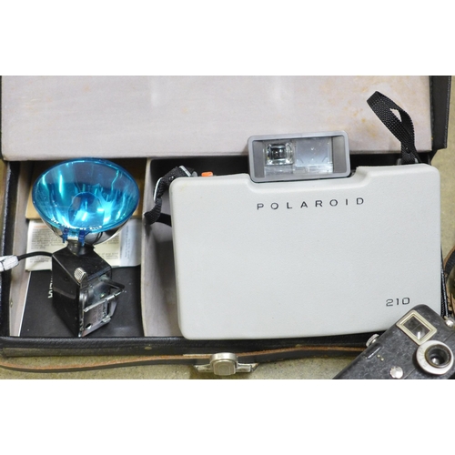 835 - A Polaroid land camera, a light bar and a Pathescope cine camera