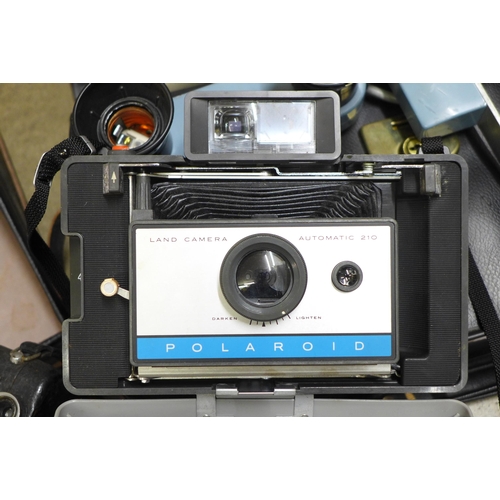 835 - A Polaroid land camera, a light bar and a Pathescope cine camera