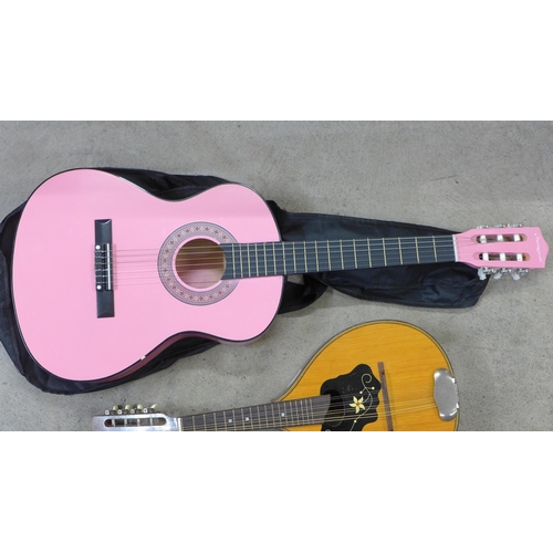 836 - A Martin Smith pink guitar and a vintage mandolin