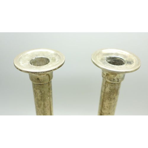 878 - A pair of silver candlesticks, marked Barton Silver,  weighted, 18cm