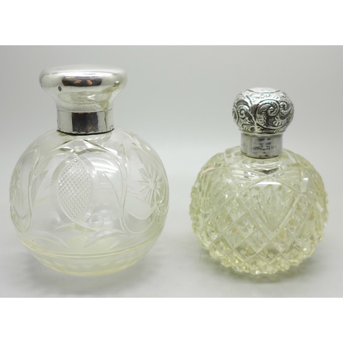 884 - Two silver topped glass scent bottles, one by William Comyns