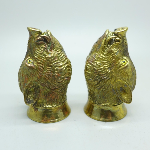 894 - A pair of well modelled gold plated boar's head salt and pepper condiments, marked '18ct gold plate'