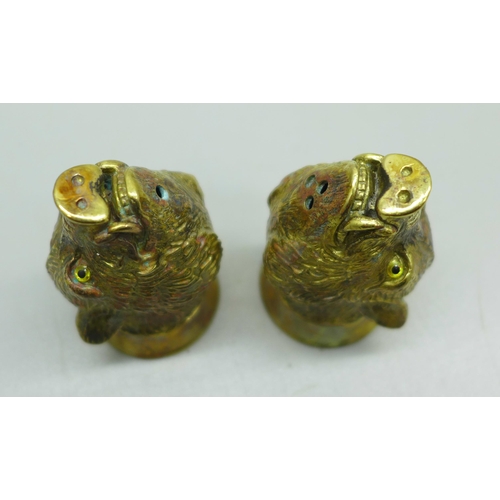 894 - A pair of well modelled gold plated boar's head salt and pepper condiments, marked '18ct gold plate'