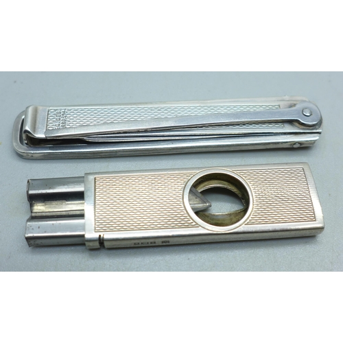 904 - A silver cigar cutter, a/f, and a silver pipe smokers tool