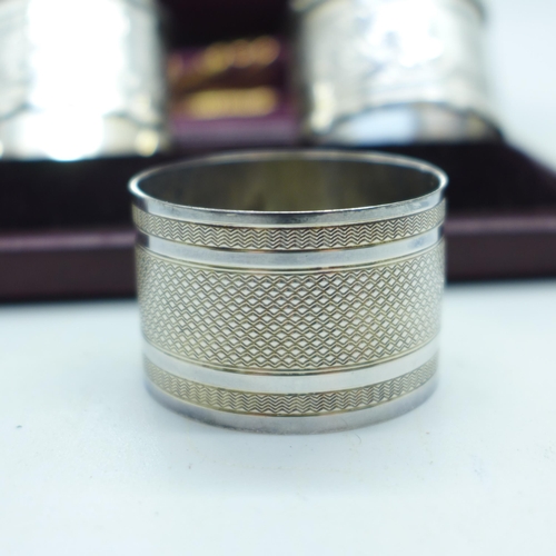 909 - A pair of silver napkin rings and one other silver napkin ring, 67g