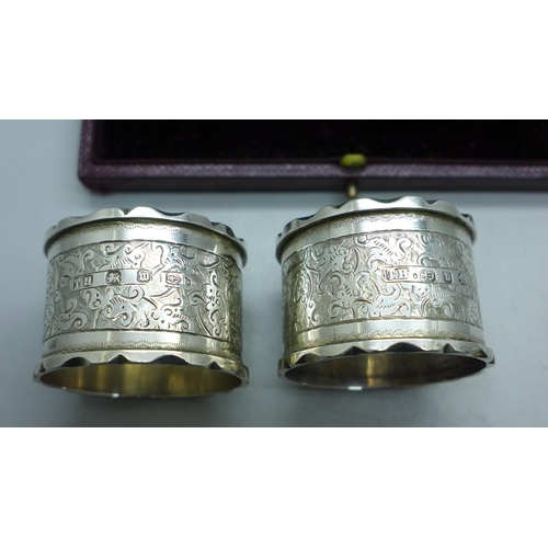 909 - A pair of silver napkin rings and one other silver napkin ring, 67g