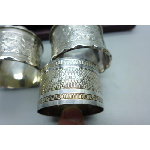 909 - A pair of silver napkin rings and one other silver napkin ring, 67g