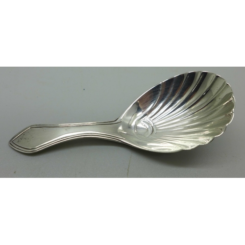 910A - A George III silver caddy spoon, London 1802, maker R.C.