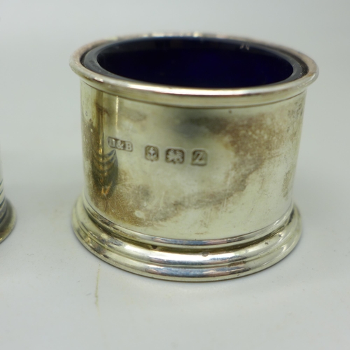 910B - A Victorian silver mustard and pepper, London 1885/6, and a silver salt, 111g