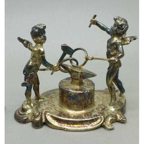 910C - Two small silver cherub figures on stands, 72g