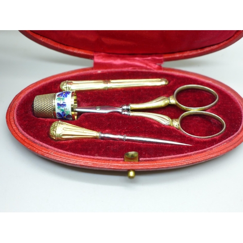 915 - A continental silver gilt neccessaire, set in case