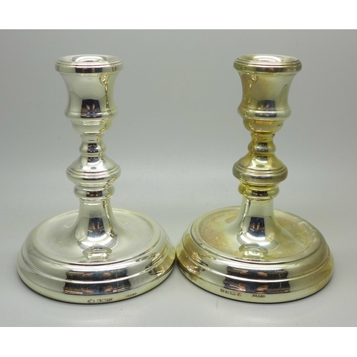 916 - A pair of small silver candlesticks, 11cm